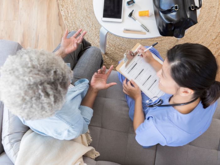 Female Doctor and elderly patient